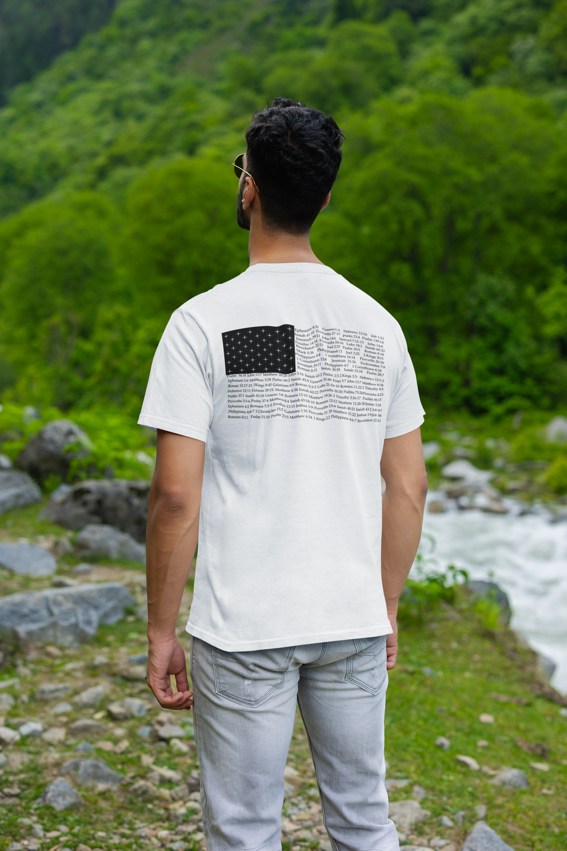 Back view of a man wearing a white Christian apparel shirt with Bible verse for encouragement — faith-based American flag tee for Greek Orthodox, Roman Catholic, or Protestant wear.