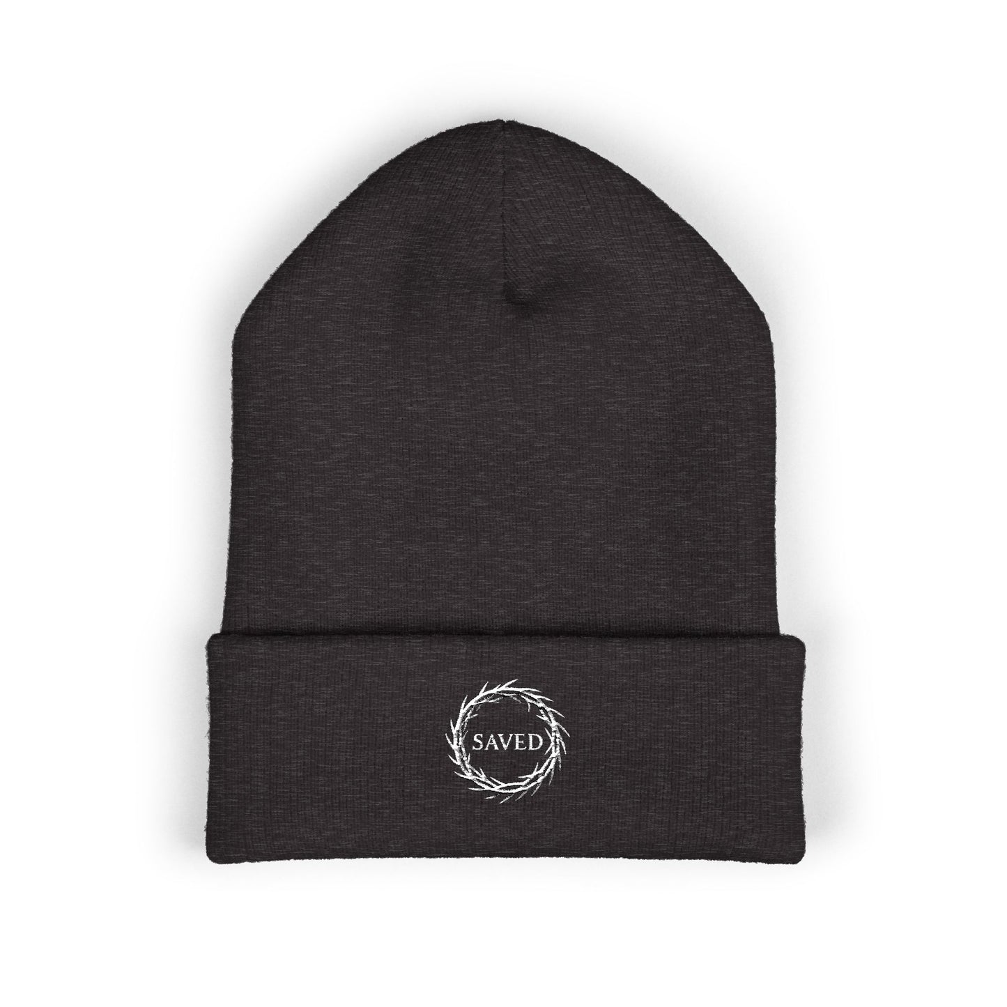 Dark gray Christian beanie with embroidered “Saved” text inside a crown of thorns, minimalist faith-based winter hat, unisex cuffed beanie, Christian streetwear accessory, gospel-inspired apparel on white background.