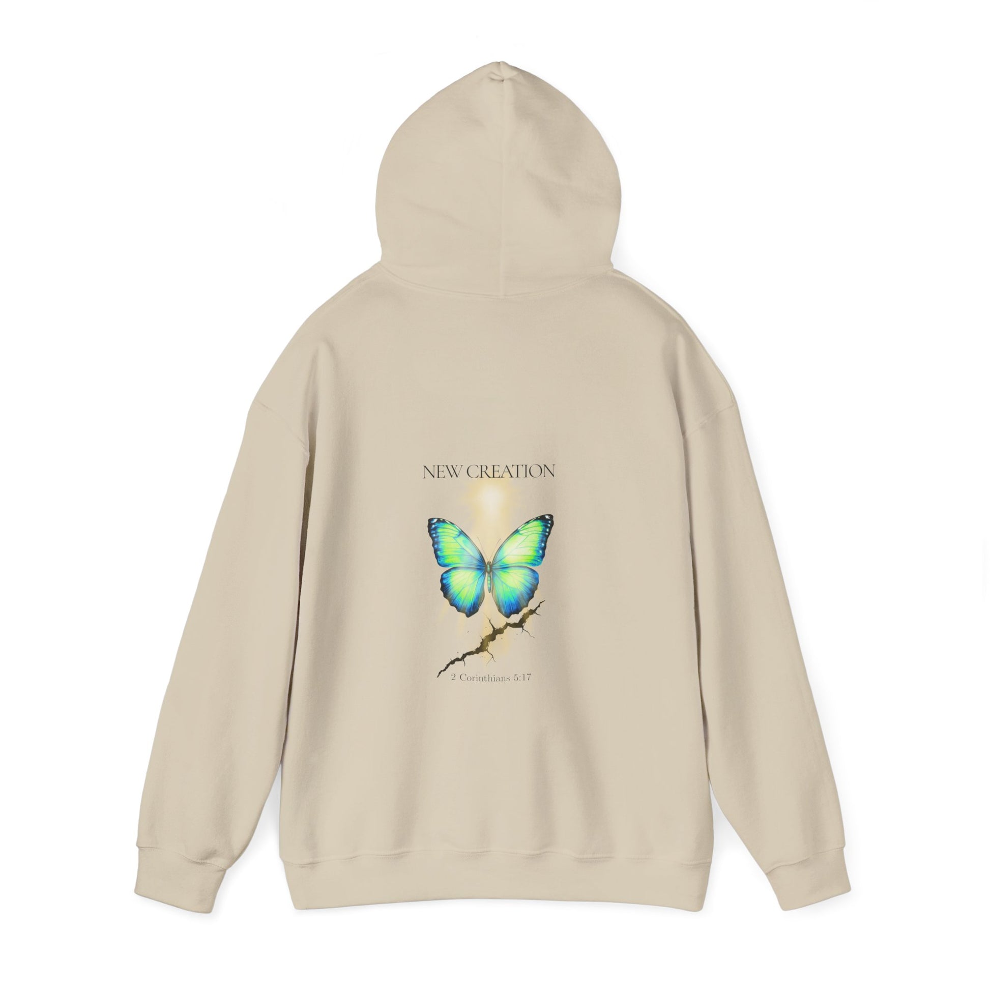 Christian hoodie with the hood up featuring a blue and green butterfly rising above a cracked rock, symbolizing transformation and renewal. The design includes the words 'NEW CREATION' at the top and '2 Corinthians 5:17' at the bottom, representing the Bible verse about becoming a new creation in Christ.