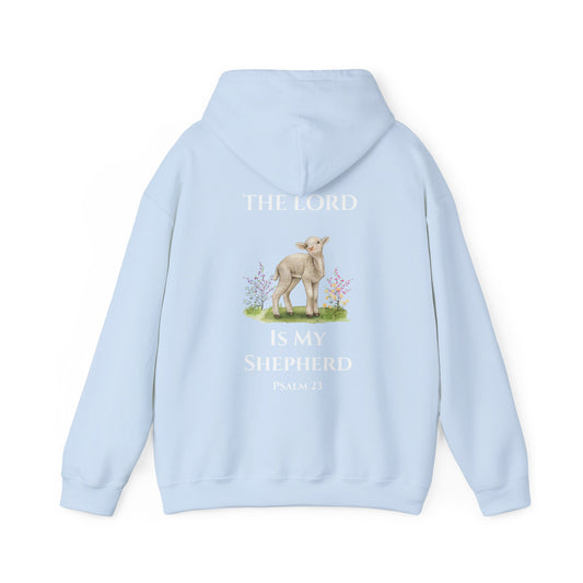 Light blue Christian hoodie featuring a lamb illustration with floral details and the Bible verse “The Lord Is My Shepherd – Psalm 23” printed on the back, displayed on a clean white background.