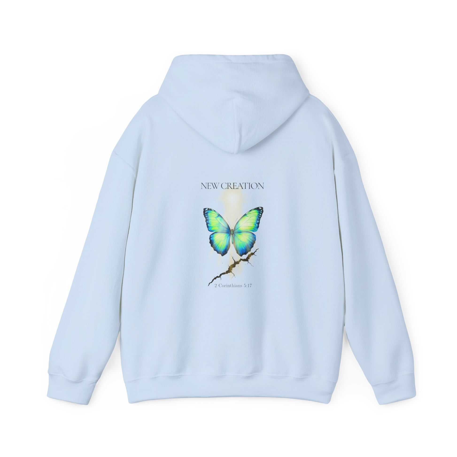 Light blue Christian hoodie featuring a blue and green butterfly rising above a cracked rock, symbolizing transformation and renewal. The design includes the words 'NEW CREATION' at the top and '2 Corinthians 5:17' at the bottom, representing the Bible verse about becoming a new creation in Christ.