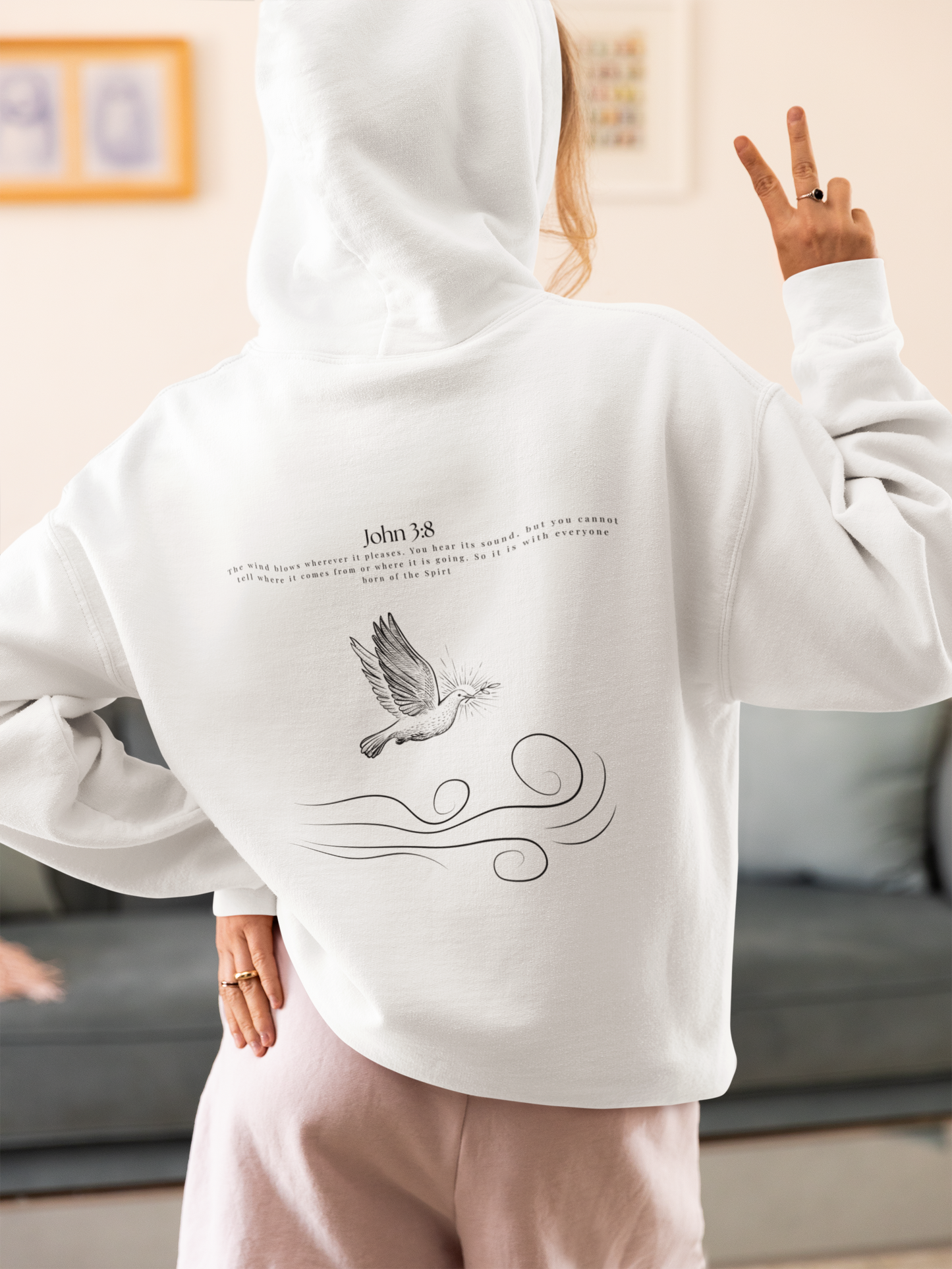 Women wearing a White Christian hoodie with John 3:8 Bible verse and dove design symbolizing the Holy Spirit, faith-based Scripture apparel for men and women